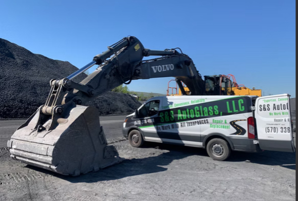S&S AutoGlass van at heavy equipment job site